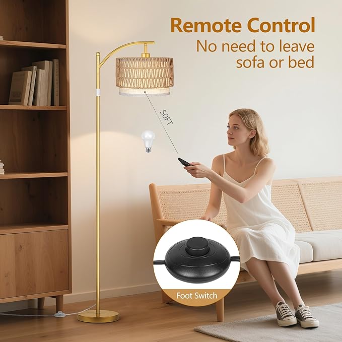 Detail of the sturdy gold metal base and sleek arc design of the standing floor lamp.