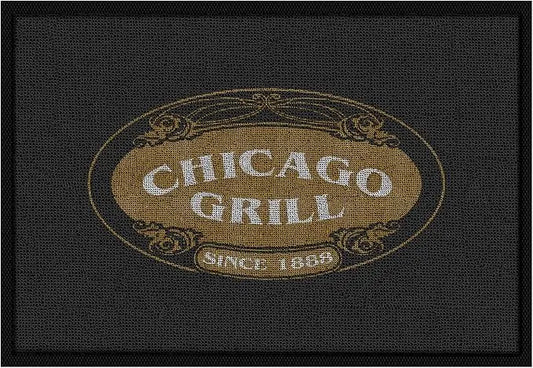 A custom personalized commercial floor mat with a business logo, laid flat in a modern entryway.