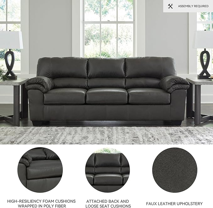 Detail of the sturdy sofa legs and base, showing the construction and finish.