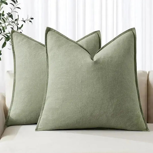 Sage green linen throw pillow covers (set of 2), neatly folded, displaying the calming color.