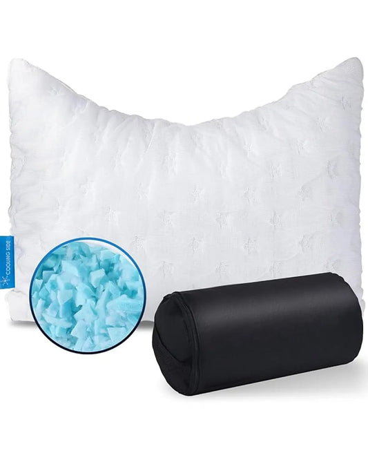 Full view of a compact crescent white travel pillow, curved for side sleepers, on a small bed.