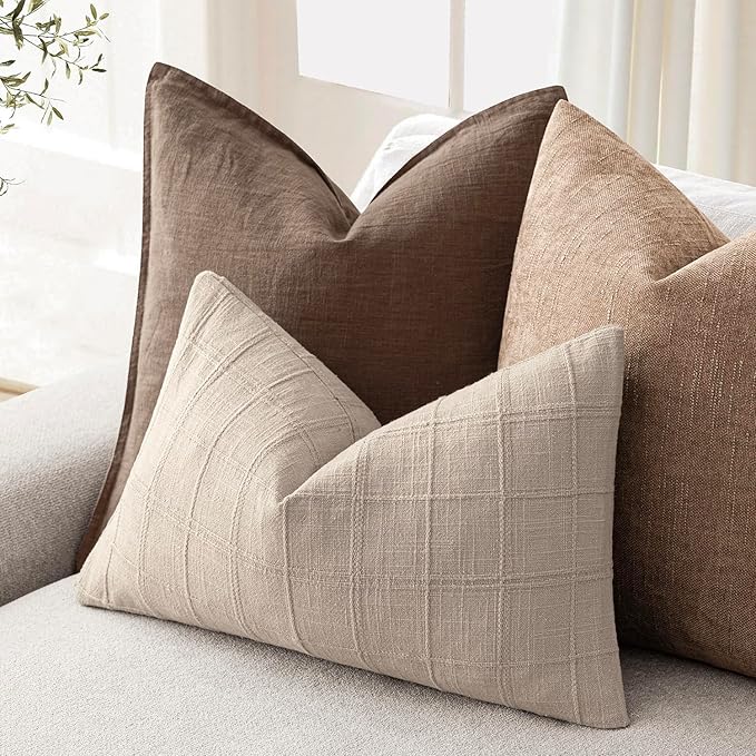 Back view of a natural linen check pillow cover, revealing the hidden zipper closure and seam craftsmanship.