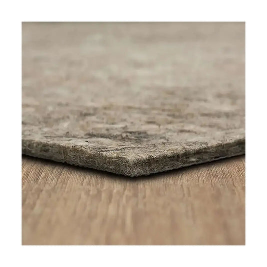 Rectangular rug pad, 7-foot x 10-foot, laid flat on a light-colored floor.