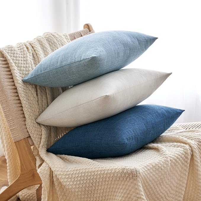 Light blue decorative pillow cover placed on a king bed, enhancing bedroom decor.