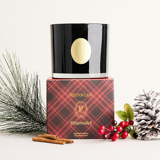 Close-up of the three wicks and smooth vegan soy wax blend surface inside the ceramic jar.