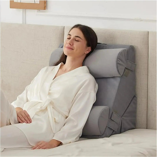 The 4-piece velvet wedge pillow set arranged for full body post-surgery support on a bed.