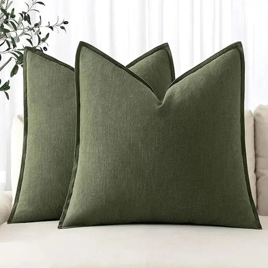 Two dark olive green 22x22 inch Euro sham pillow covers made from linen, folded neatly.