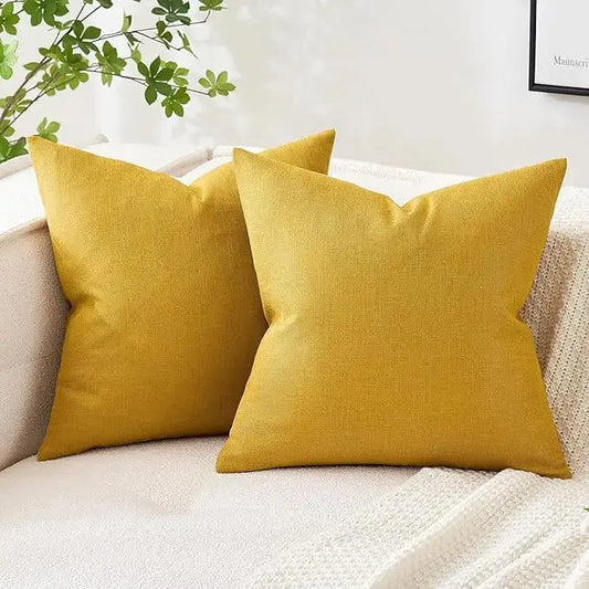 Bright yellow linen burlap throw pillow covers (set of 2) styled on a sofa.