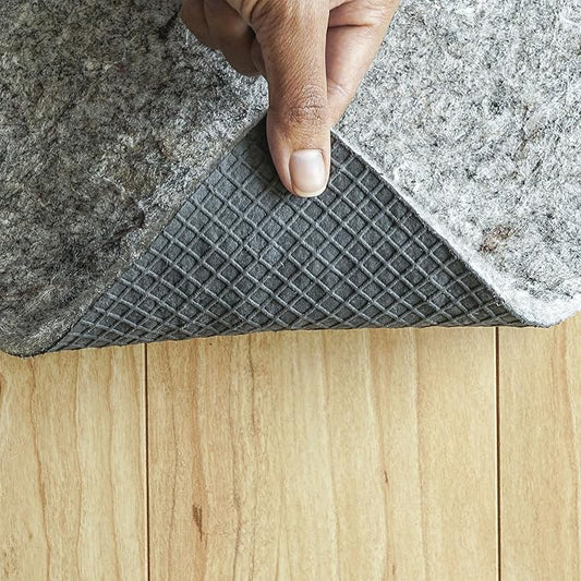 Close-up of the textured felt top surface of the rug pad, showing its soft material.
