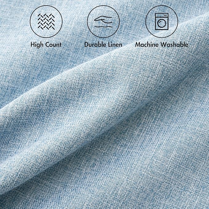 A single light blue farmhouse boho pillow cover styled on a sofa, adding a soft accent.