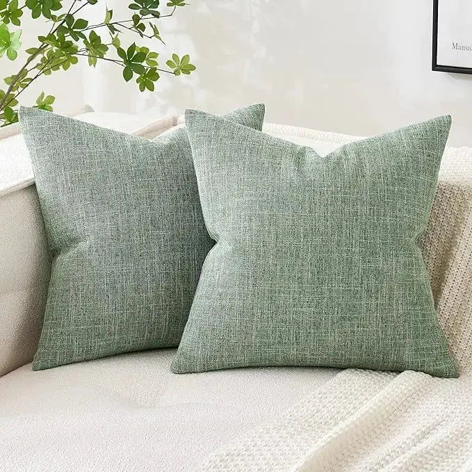 Sage green linen burlap throw pillow covers (set of 2) styled on a sofa.