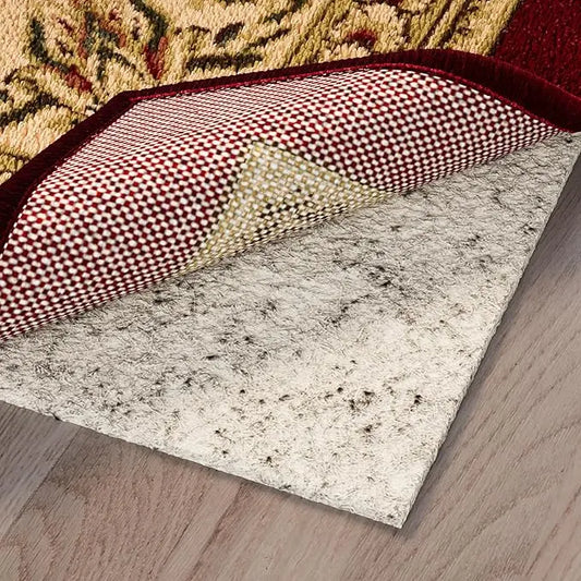 Cream Ottomanson non-slip rug pad gripper, unrolled to its full 2'7" x 10' length on a floor.