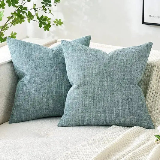 Pair of teal linen burlap throw pillow covers, square 18x18 inch, displayed flat.