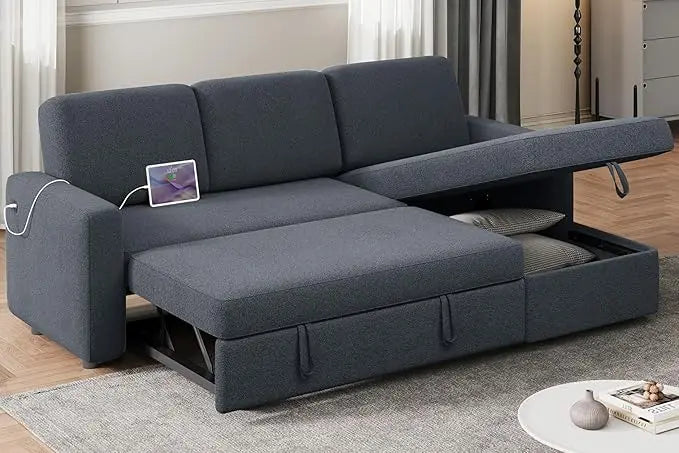 Dark gray L-shaped sectional sofa bed with pull-out sleeper and chaise in a modern living room.