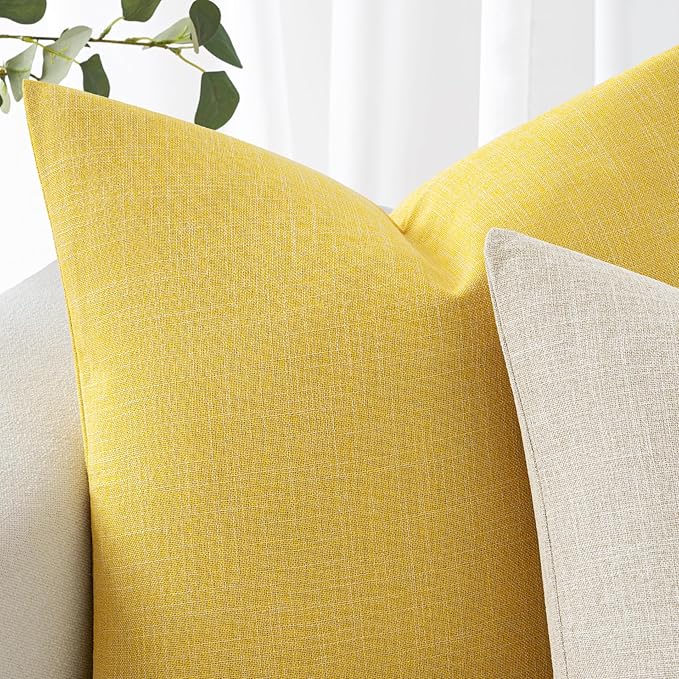 Backside view of the yellow pillow cover, emphasizing its clean, solid construction.